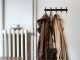 Coats and shoulder bag on hooks in house