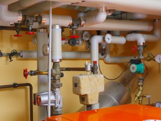 pipes and valves in a room with orange table